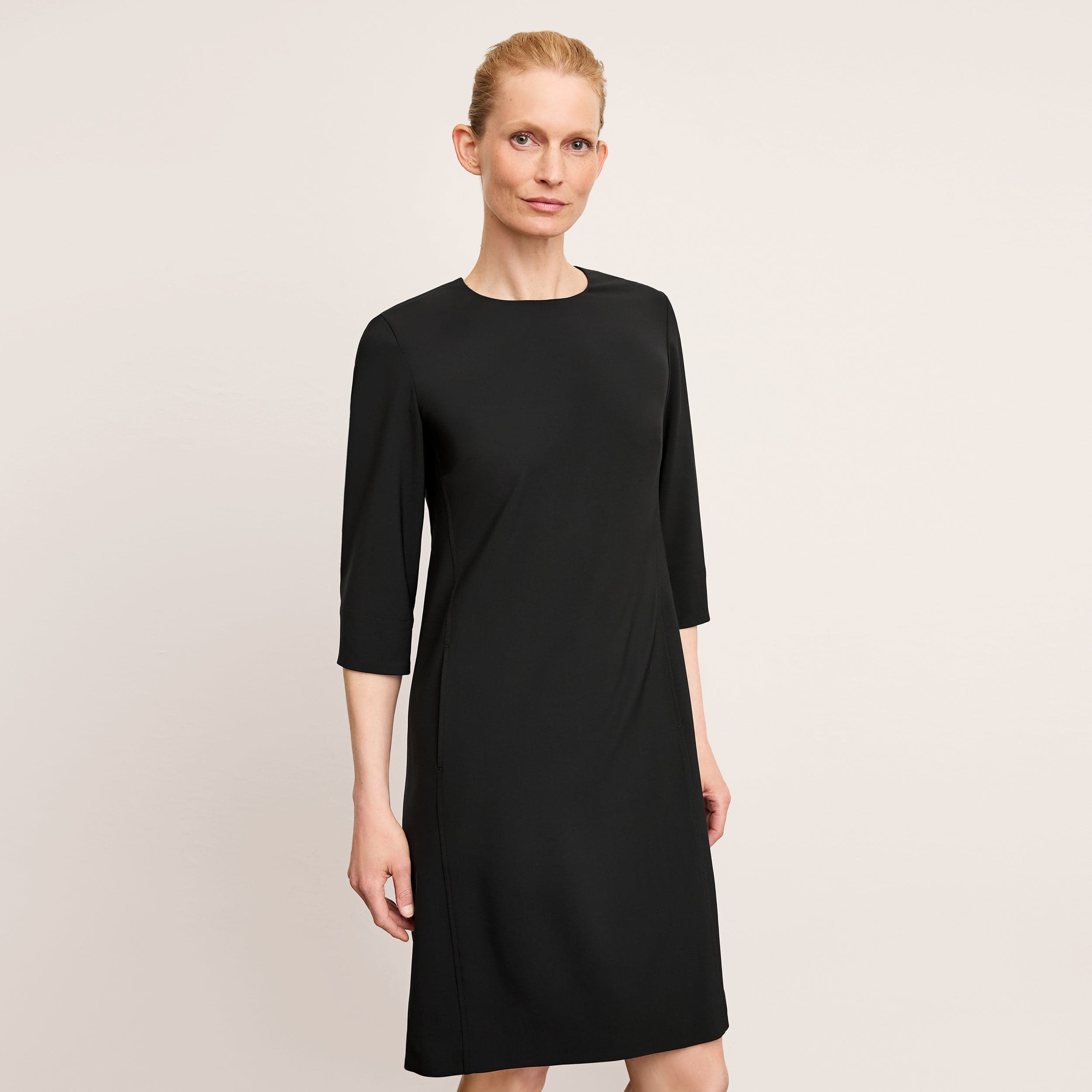 The M.M.LaFleur Lancia Travel Dress in black OrigamiTech, a three-quarter-sleeve shift dress photographed front-on.